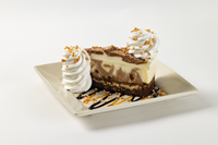 The Cheesecake Factory’s Brownie Crunch Choc-a-Lot Cheesecake debuts on National Cheesecake Day, July 30, 2026. The new flavor features creamy milk and white chocolate marbled cheesecake atop a rich, crunchy toffee brownie.